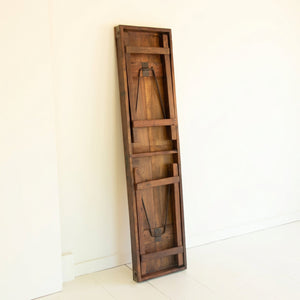 Reclaimed wood console table folded flat for storage