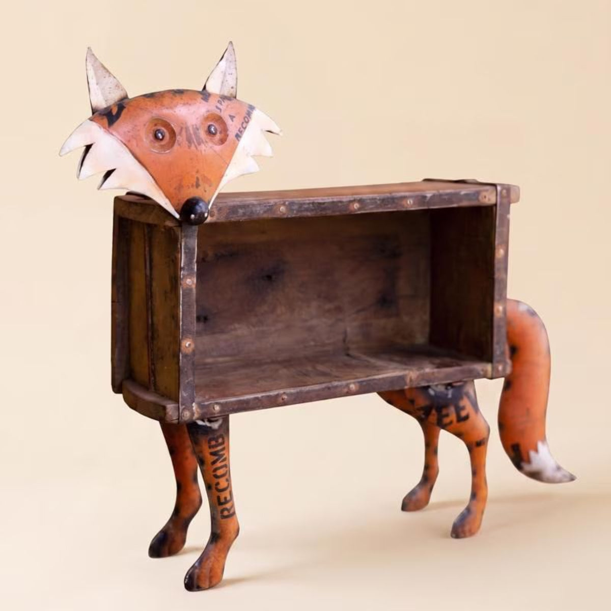Recycled metal fox brick mold accent on a white background