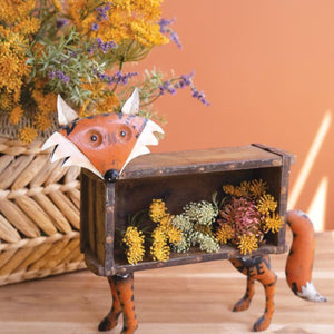 Recycled metal fox with brick mold body filled with flowers