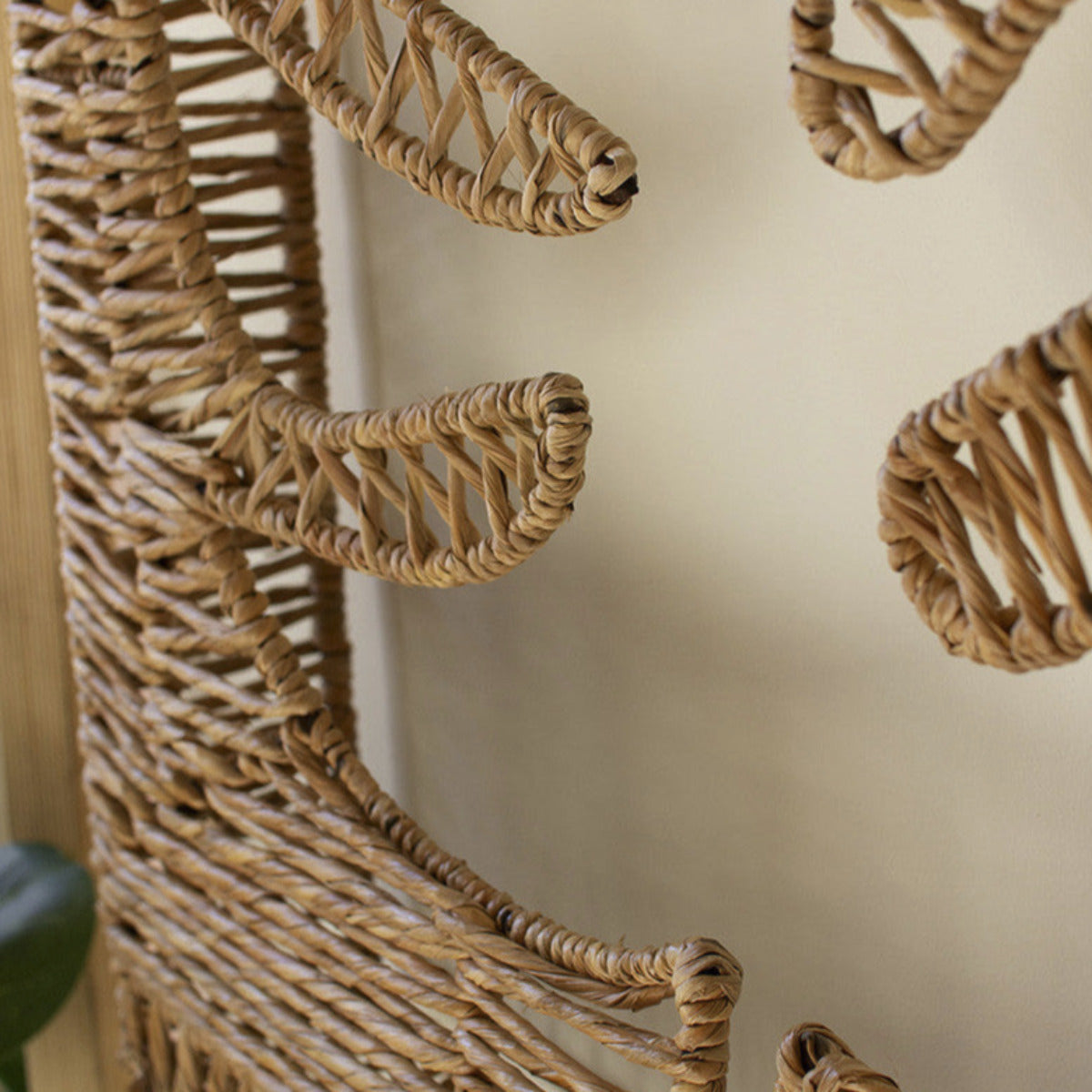 Handcrafted woven seagrass and iron leaf wall panel