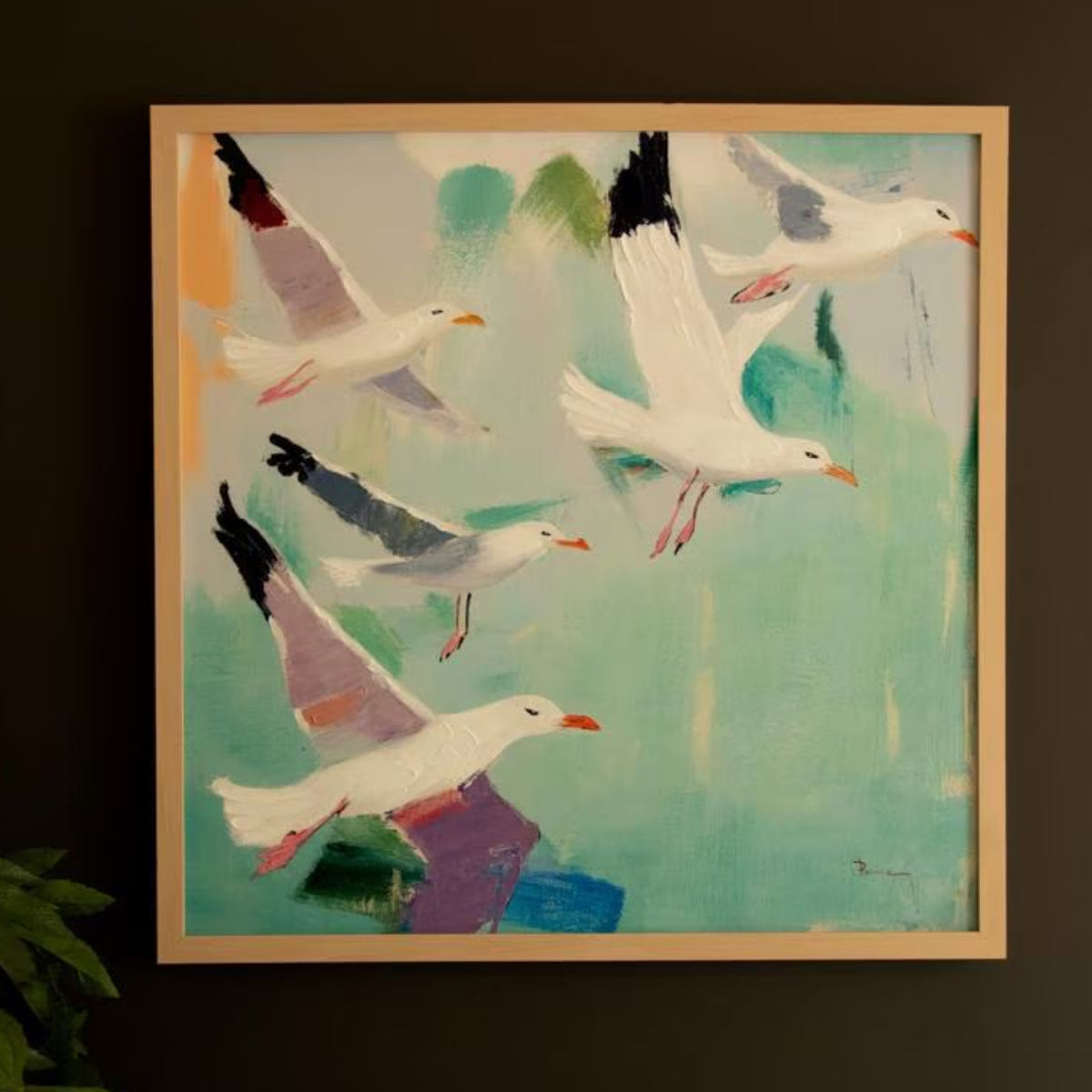 Coastal seagull canvas hung on a dark wall