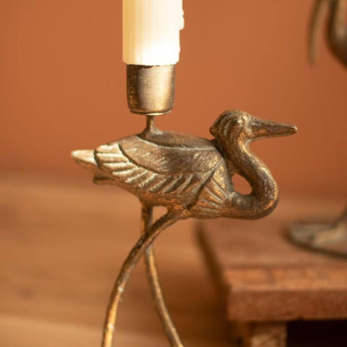 Close-up of brass shore bird candle holder