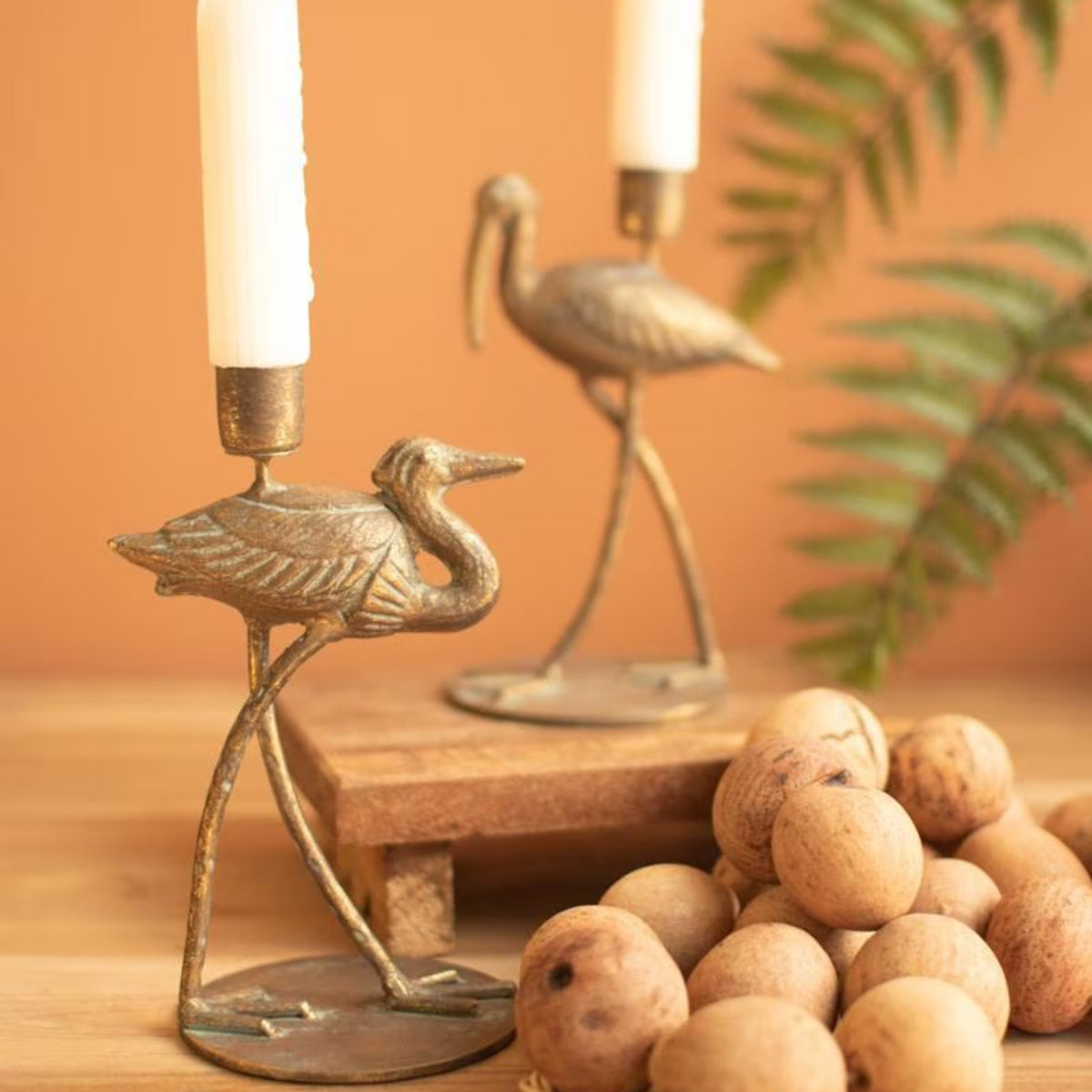 Pair of shore bird taper holders styled with wood beads