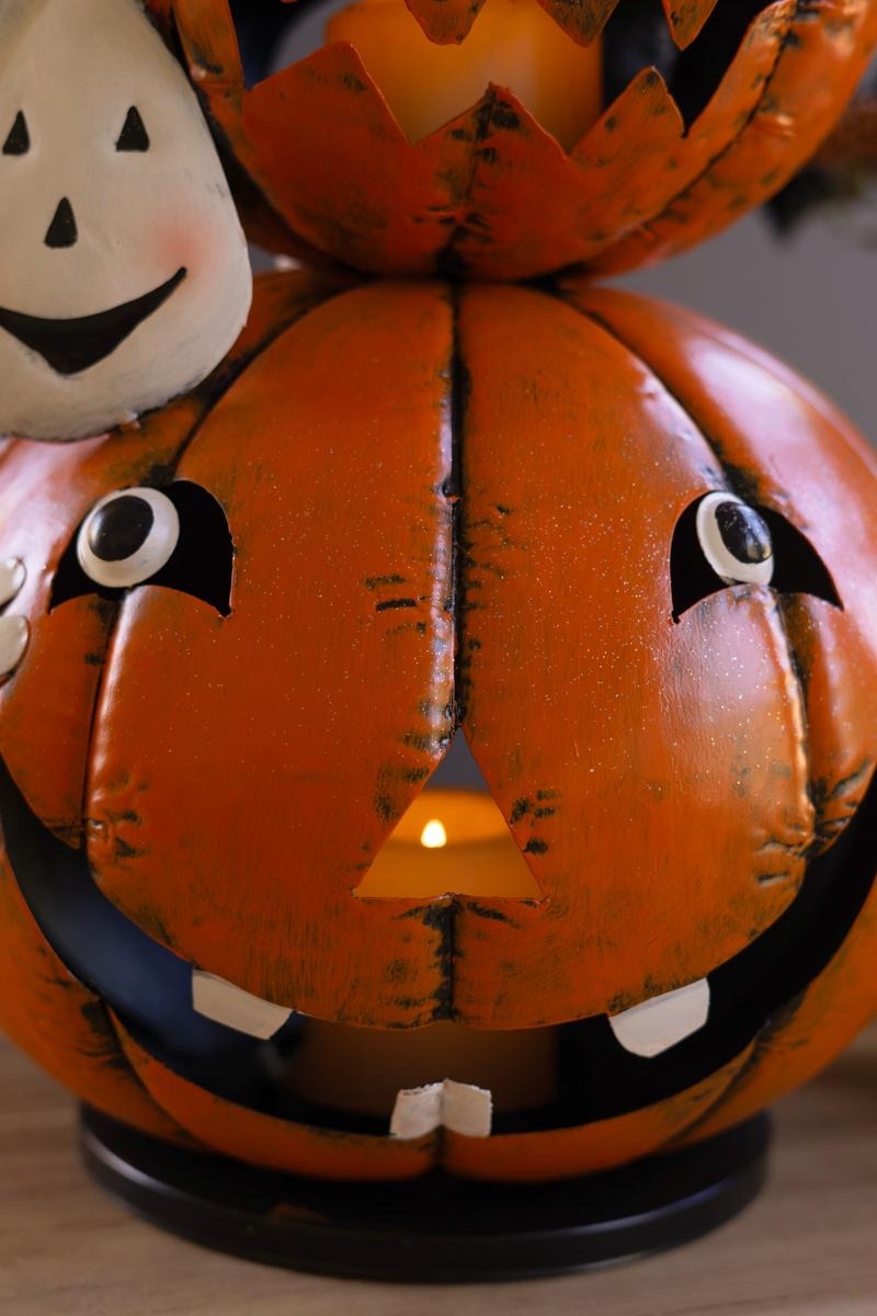 Detail of painted jack-o-lantern face with distressed orange finish
