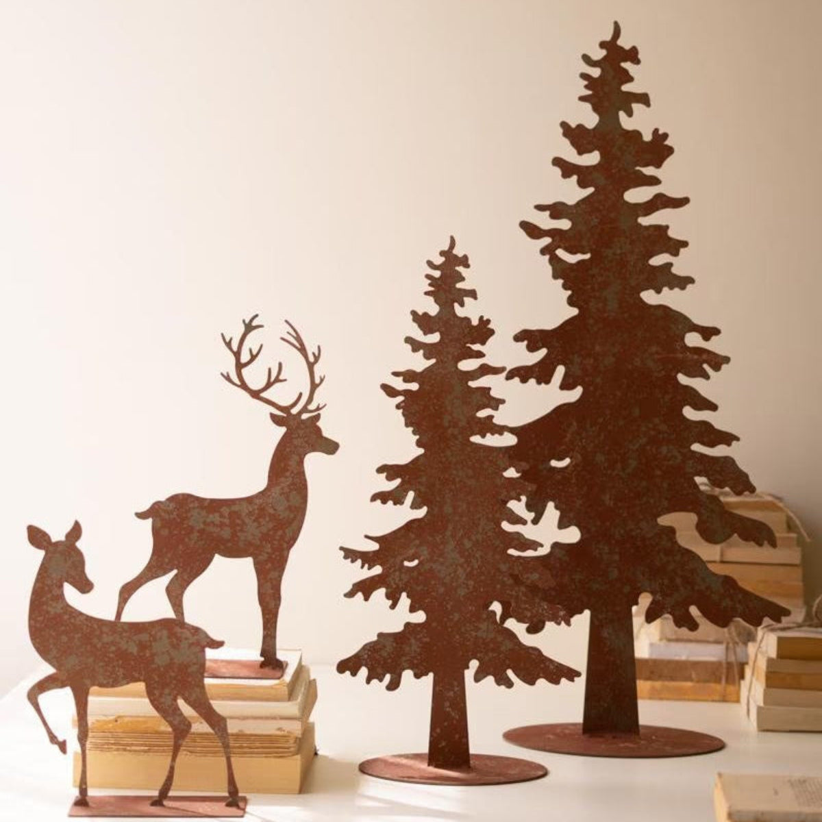 Stag & Pine Forest Silhouettes, rustic metal stag, doe and two pine trees set of 4 on a stack of books