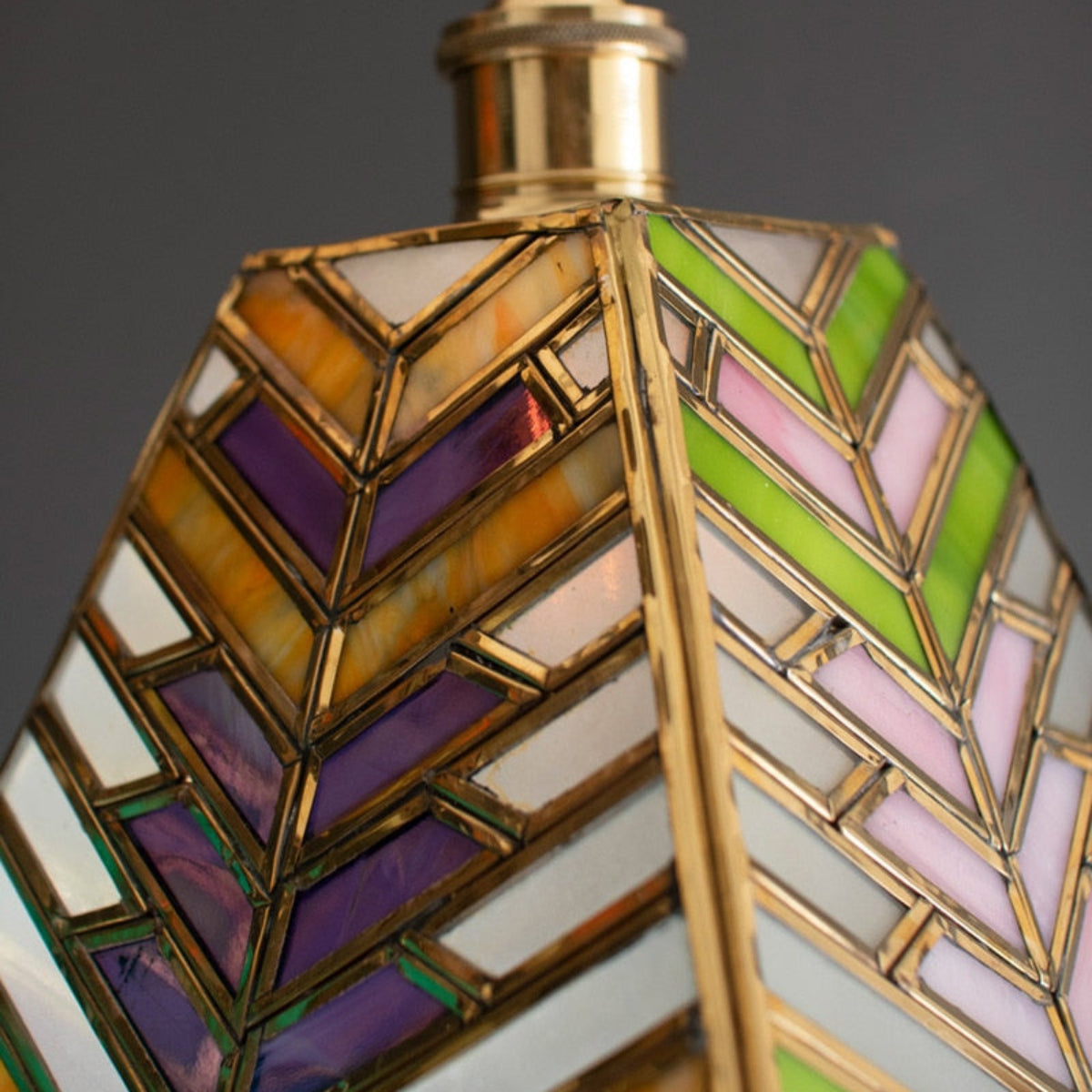 Stained glass pendant casting colorful light