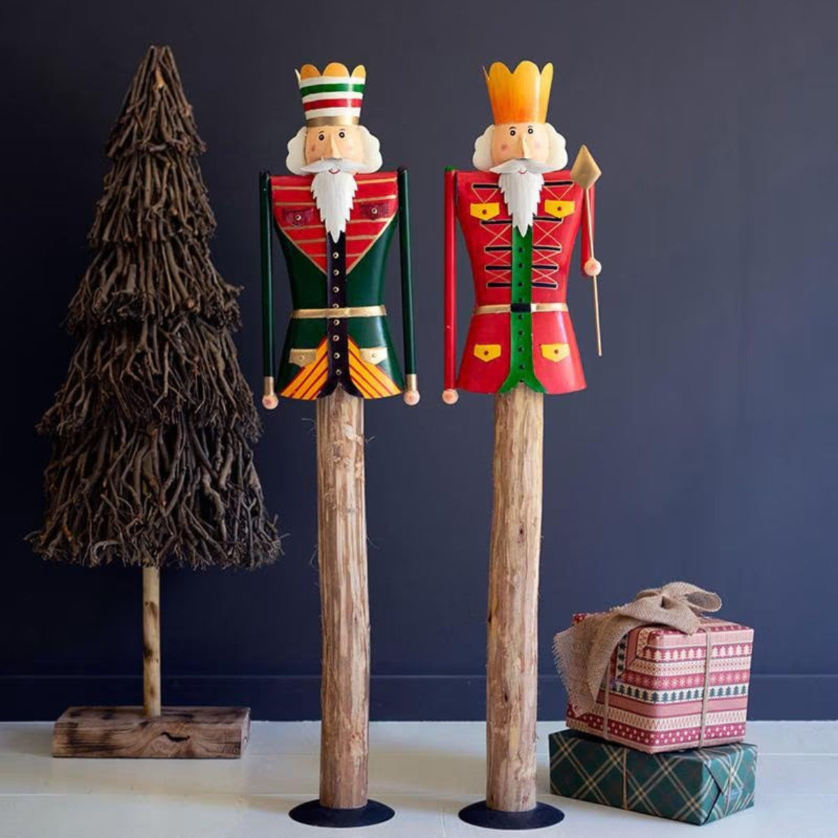 Timberline Nutcracker Guards, set of 2 hand-painted red and green metal nutcrackers on tall wood posts
