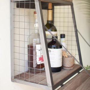 Open wall mounted mini bar with bottles and glasses