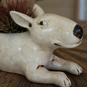 Side view of white ceramic dog planter