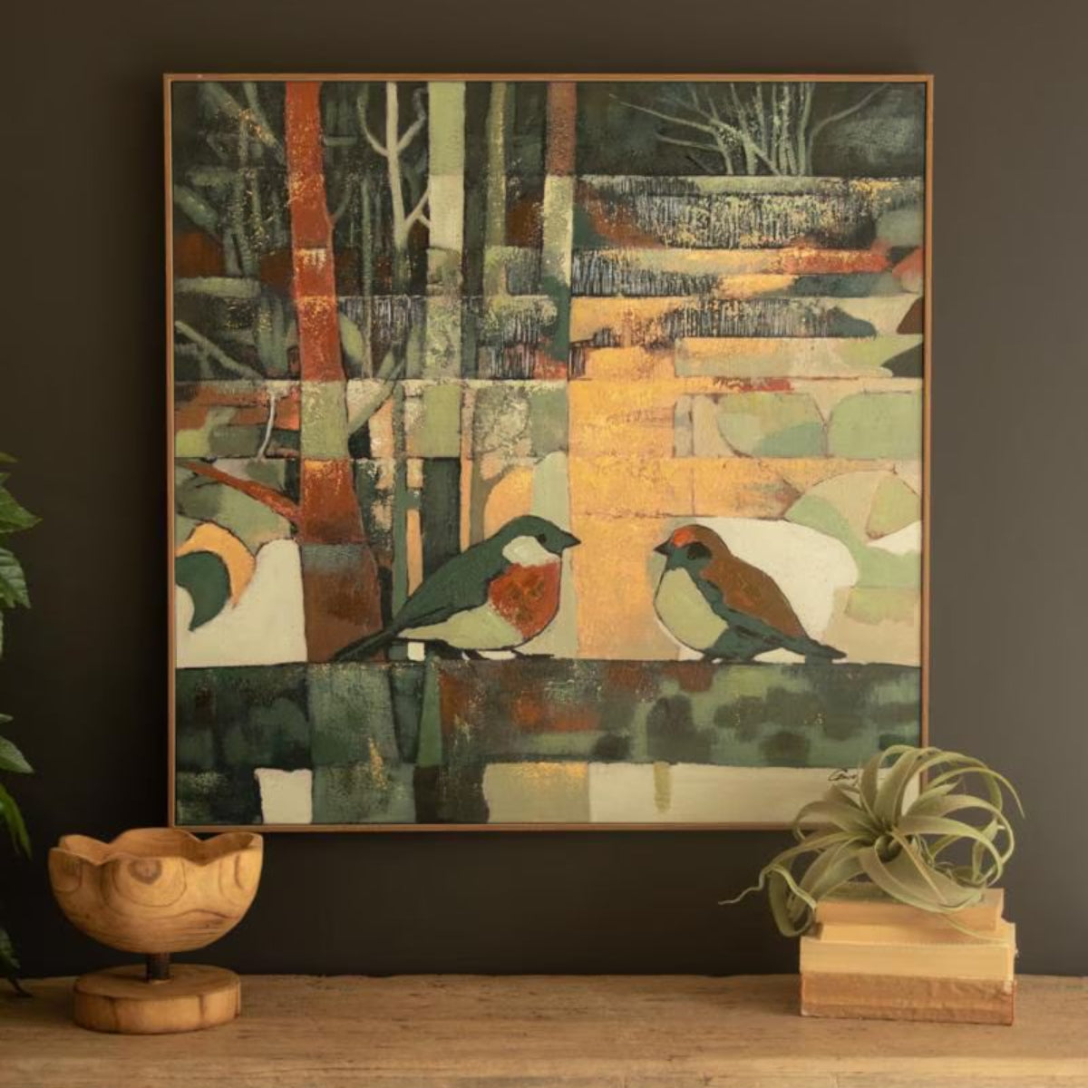 Abstract forest canvas art hung above a wood console