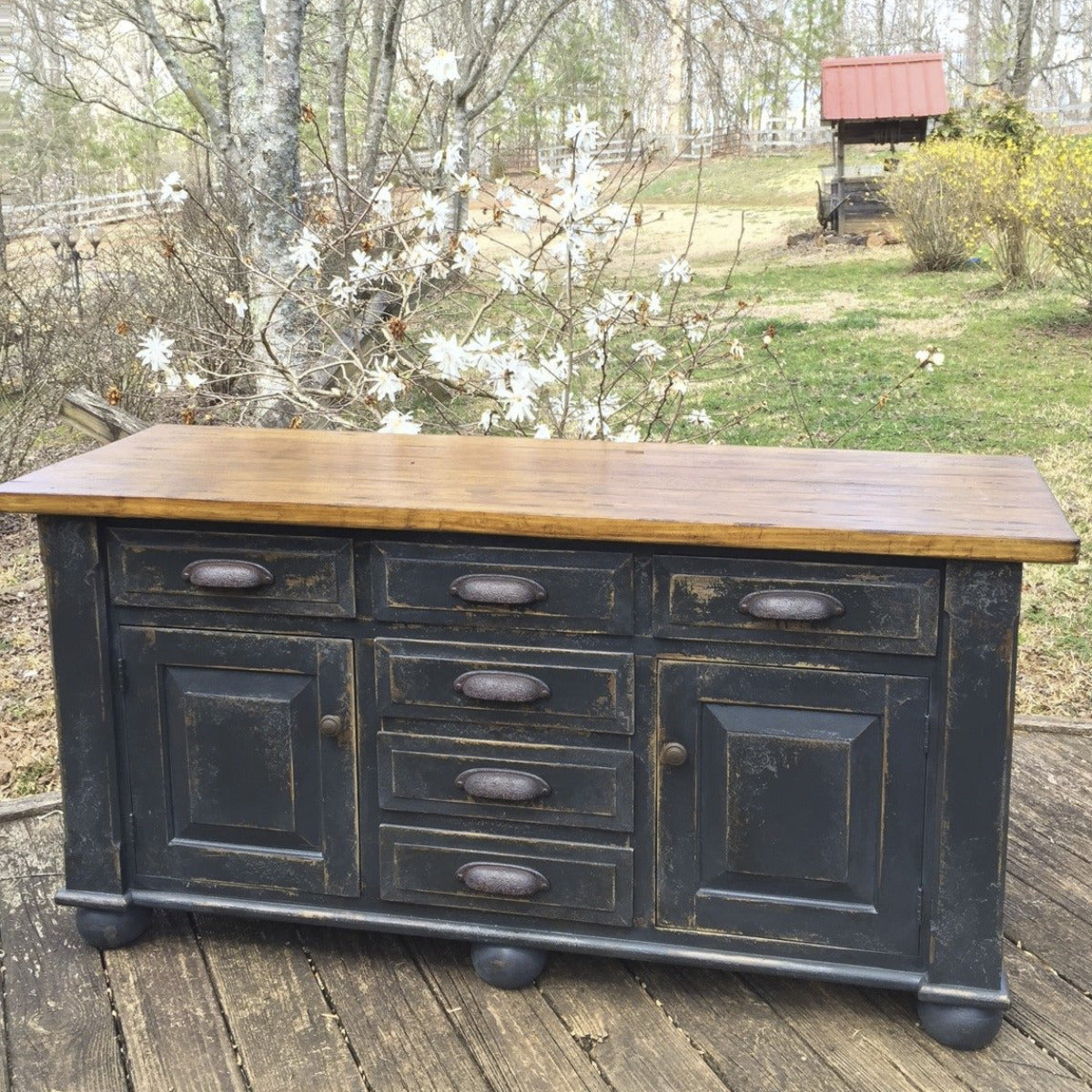 Distressed black and wood media cabinet with doors and drawers