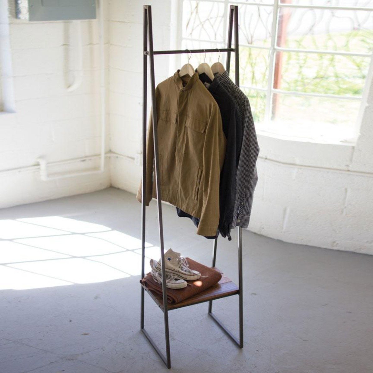 Freestanding metal coat rack with lower shelf for shoes and bags