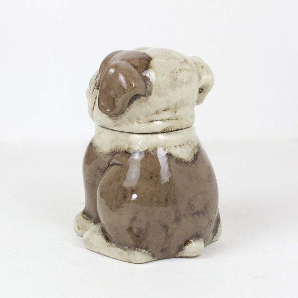 Side view of brown and cream ceramic bulldog jar