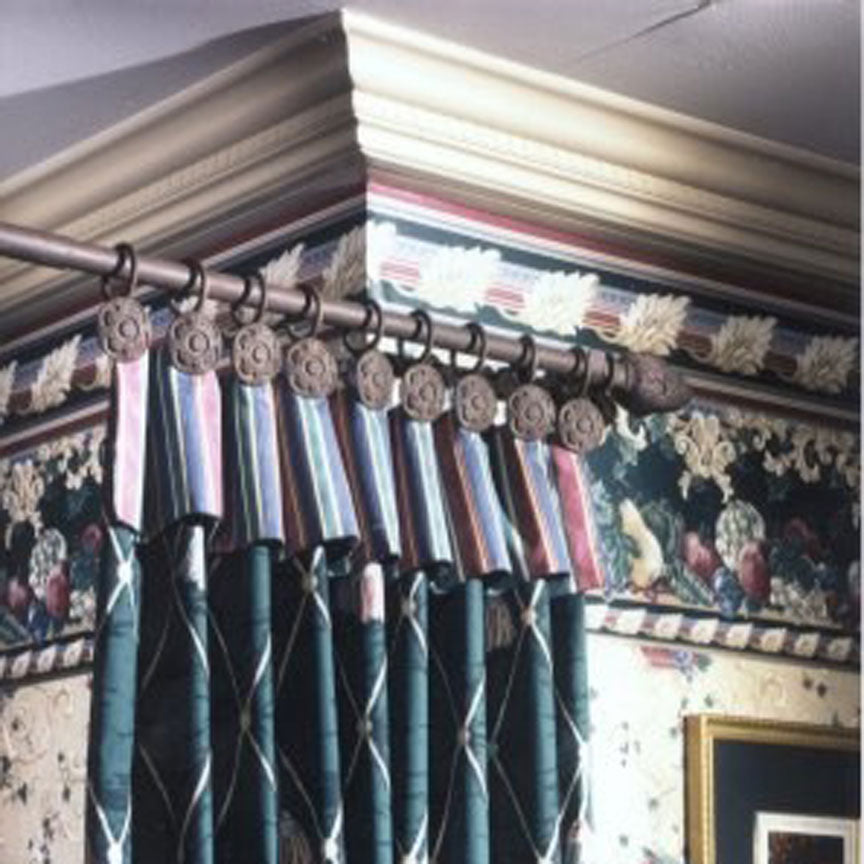 Custom decorative drapery hardware with iron rods and ornamental rings